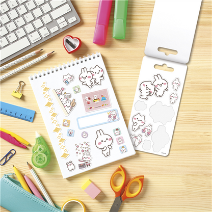 Sticker sheets with cute designs on a desk with stationery items