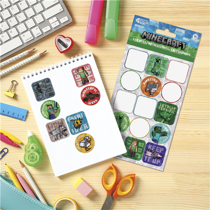 Sticker book with Minecraft-themed stickers on a desk with stationery items