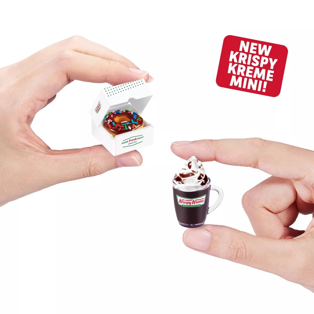 Miniature Krispy Kreme doughnut and coffee cup with hands holding them, and a 'New Krispy Kreme Mini!' sign.