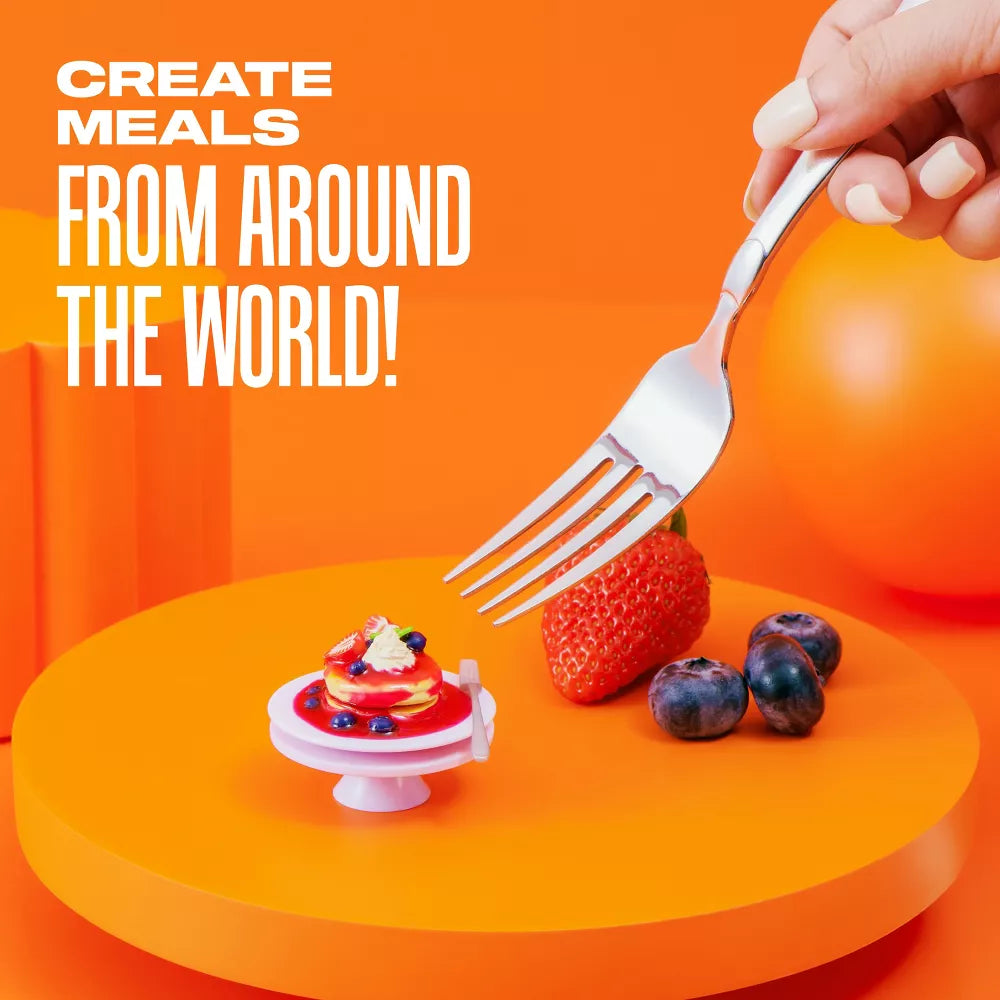 Fork picking up a small dessert with text 'Create meals from around the world!' on an orange background