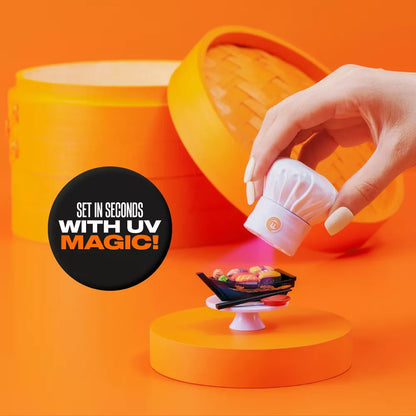 Hand holding a small UV light device over a smartphone on an orange background with text 'Set in seconds with UV magic'.