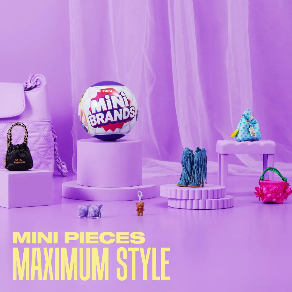 Mini Brands toy on a purple platform with other toys and a handbag against a purple curtain.
