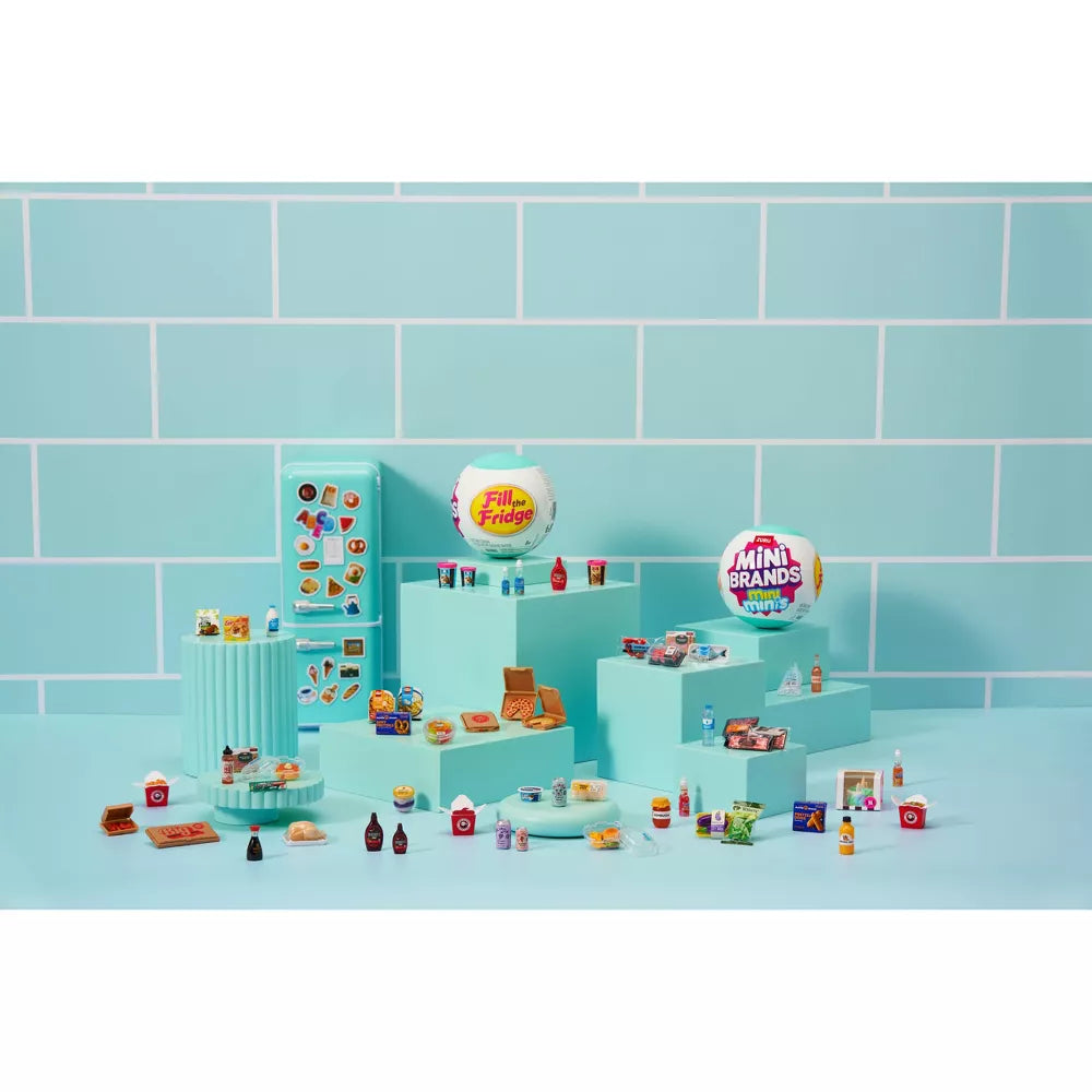 Toy set with various miniature items on a blue tiled background