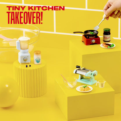 Miniature kitchen scene with cooking utensils and ingredients on a yellow background, featuring 'Tiny Kitchen Takeover!' text.