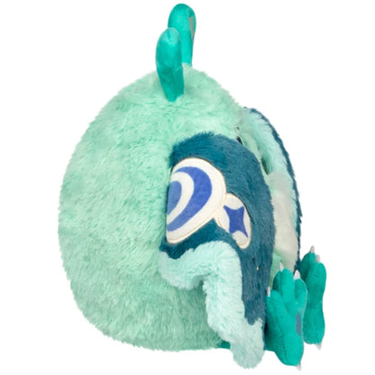 Mini Squishable Alien Mothman plush featuring mint green fur, three purple eyes, and patterned teal wings.