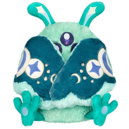Mini Squishable Alien Mothman plush featuring mint green fur, three purple eyes, and patterned teal wings.
