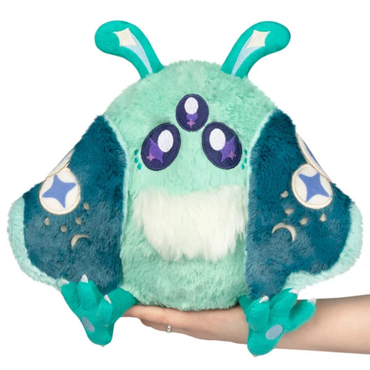 Mini Squishable Alien Mothman plush featuring mint green fur, three purple eyes, and patterned teal wings.