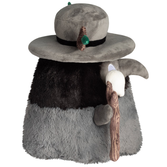 Side view of Mini Squishable Druid Plague Doctor plush in forest green robes with leafy details