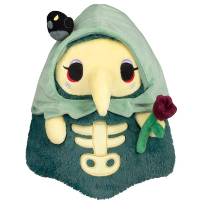 Mini Squishable Graveyard Plague Nurse plush with green cloak, skeleton embroidery, rose, and bat