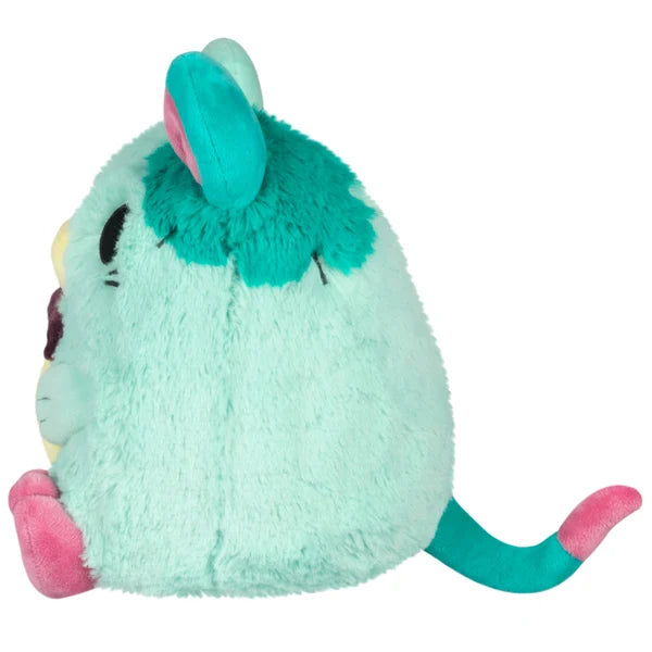 Mini Squishable Mori the Plague Rat plush featuring mint and teal fur, a pink paw accent, and a dark bow tie.