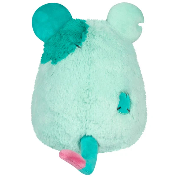 Mini Squishable Mori the Plague Rat plush featuring mint and teal fur, a pink paw accent, and a dark bow tie.
