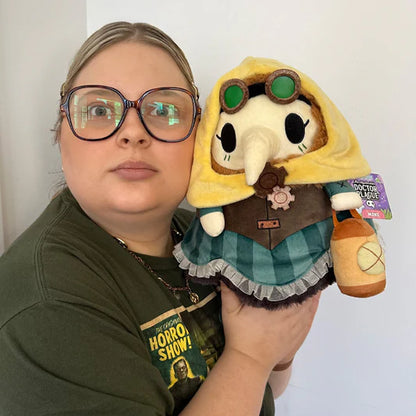 Woman holding Mini Squishable Steampunk Plague Nurse plush in steampunk gear attire