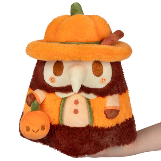 Mini Squishable Pumpkin Spice Doctor Plague plush with pumpkin hat and cinnamon stick