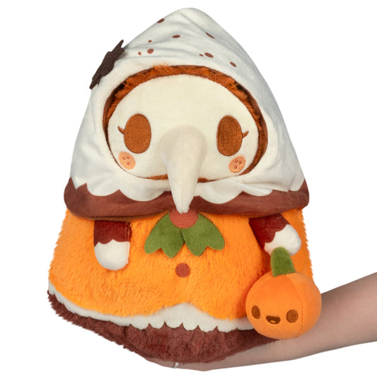 Mini Squishable Pumpkin Spice Plague Nurse plush with pumpkin accessory