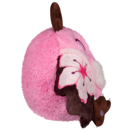 Mini Squishable Sakura Mothman plush with a pink body, fluffy white belly, brown antennae, and pink wings featuring cherry blossom designs.