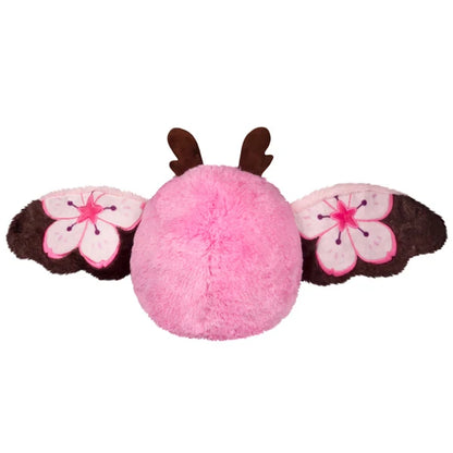 Mini Squishable Sakura Mothman plush with a pink body, fluffy white belly, brown antennae, and pink wings featuring cherry blossom designs.