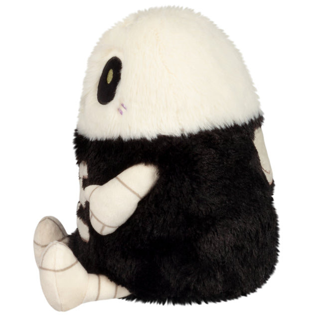 Side view of Mini Squishable Skeleton plush with stitched grin and embroidered bones