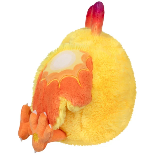 Mini Squishable Solar Mothman plush featuring bright yellow fur, orange wings, and red gradient antennae.
