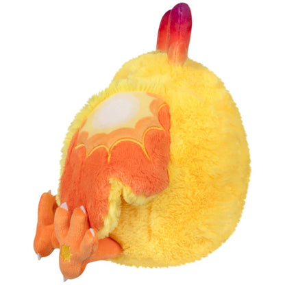 Mini Squishable Solar Mothman plush featuring bright yellow fur, orange wings, and red gradient antennae.