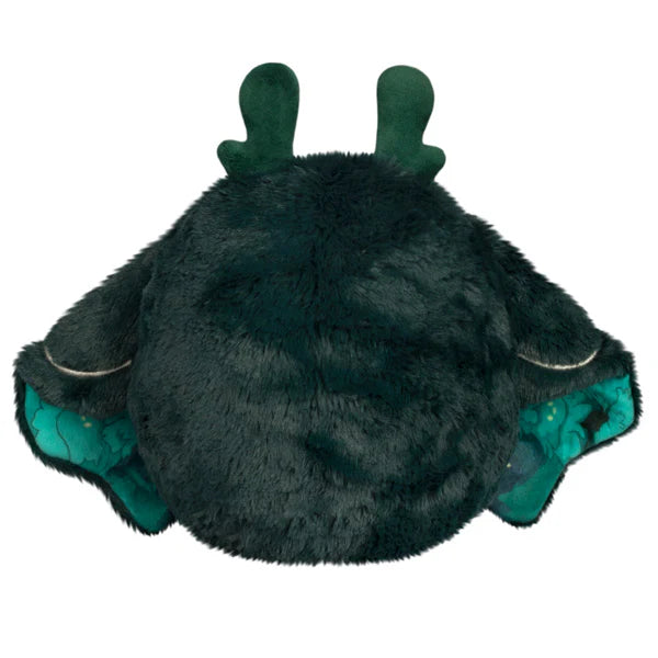 Squishable Mini Dark Forest Mothman 9-Inch Plush, a dark green cryptid soft toy with bright green chest fluff and starry forest pattern wings