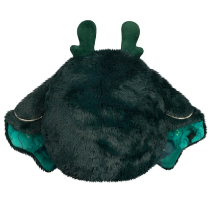 Squishable Mini Dark Forest Mothman 9-Inch Plush, a dark green cryptid soft toy with bright green chest fluff and starry forest pattern wings