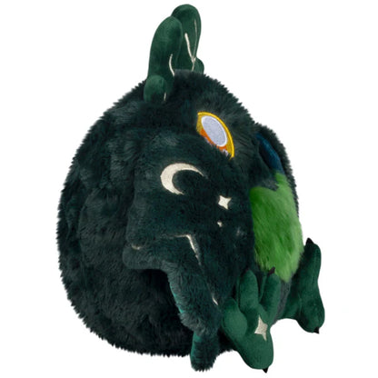 Squishable Mini Dark Forest Mothman 9-Inch Plush, a dark green cryptid soft toy with bright green chest fluff and starry forest pattern wings
