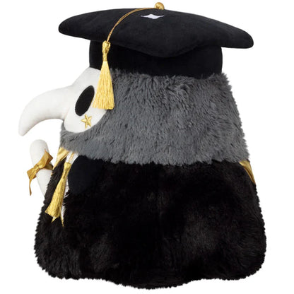 Squishable Mini Graduation Plague Doctor 10-Inch Plush, a black and dark grey soft toy with a white mask, gold accents, a graduation cap, and a diploma