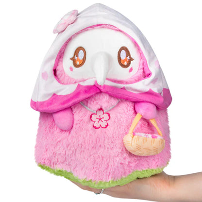 Squishable Mini Sakura Plague Nurse 10-Inch Plush, a pink and white soft toy with cherry blossom details and a small basket