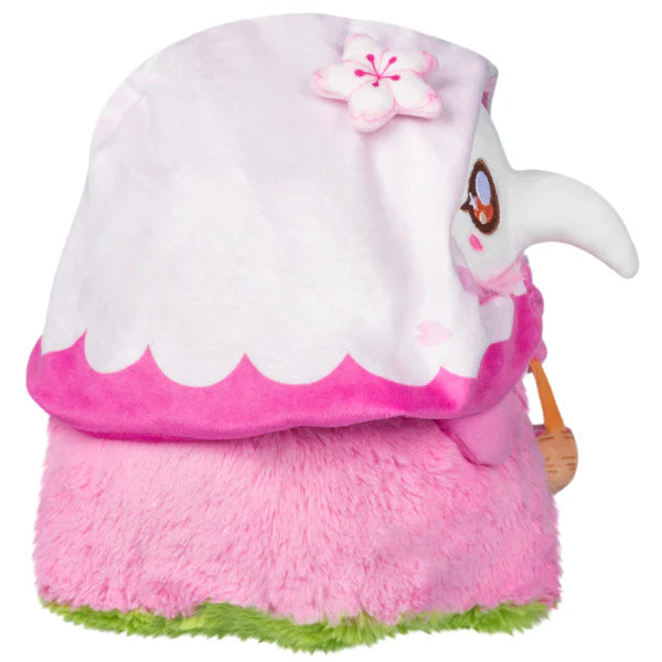 Squishable Mini Sakura Plague Nurse 10-Inch Plush, a pink and white soft toy with cherry blossom details and a small basket