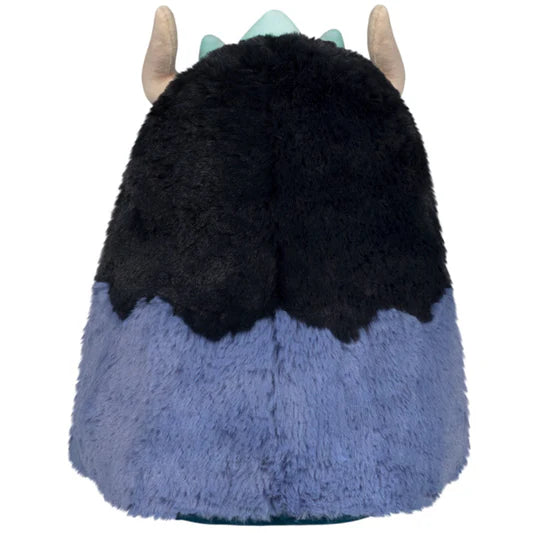 Plush toy with black and blue fur and light blue horns on a white background