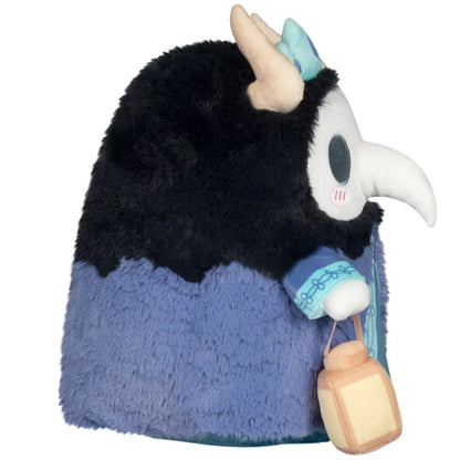 Plush toy with black and blue fur, white face, and small lantern accessory on a white background