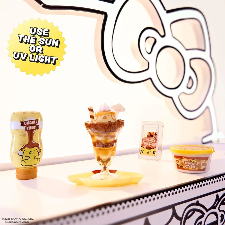 Ice cream sundae with caramel syrup bottle and container, branded logo in the background. Miniverse Make It Mini Hello Kitty Series 2.