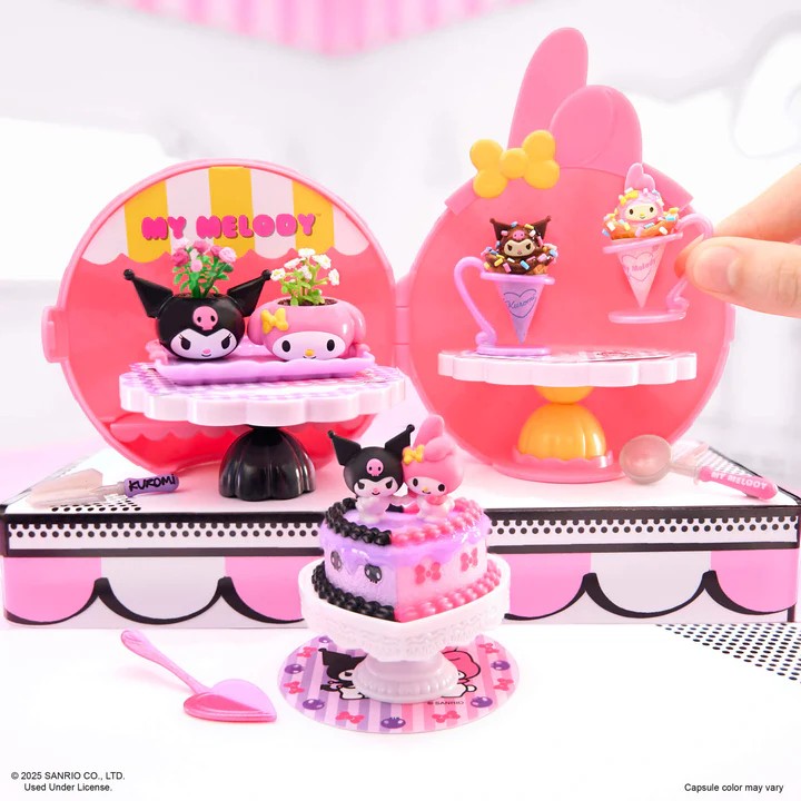 Toy set with a pink case featuring 'My Melody' character, including a cake and other accessories. Miniverse Make It Mini Hello Kitty Series 2.