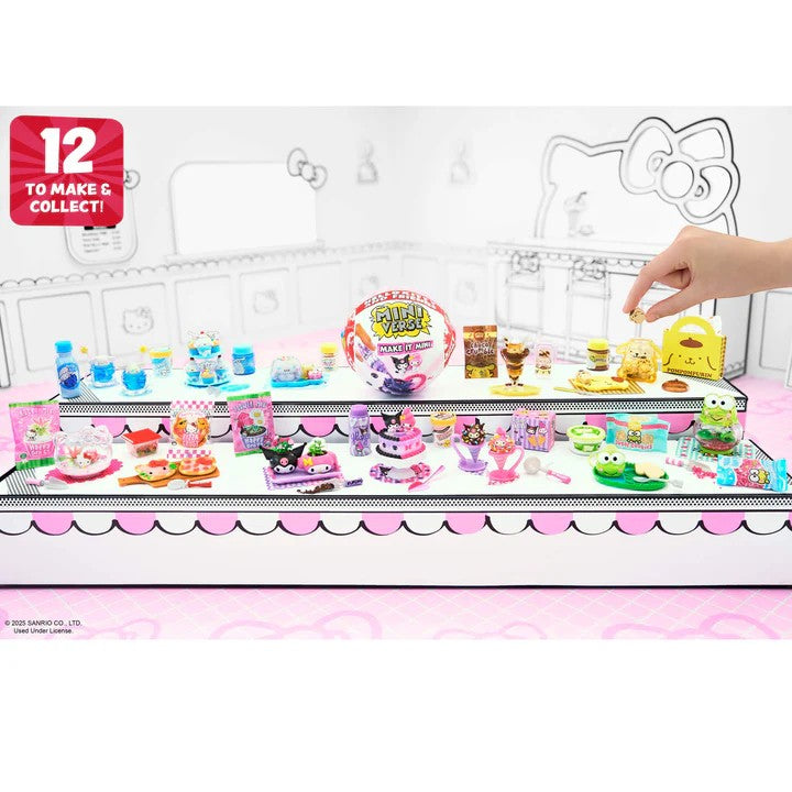 Playset with various toys and a hand interacting with it, featuring a Hello Kitty design. Miniverse Make It Mini Hello Kitty Series 2.