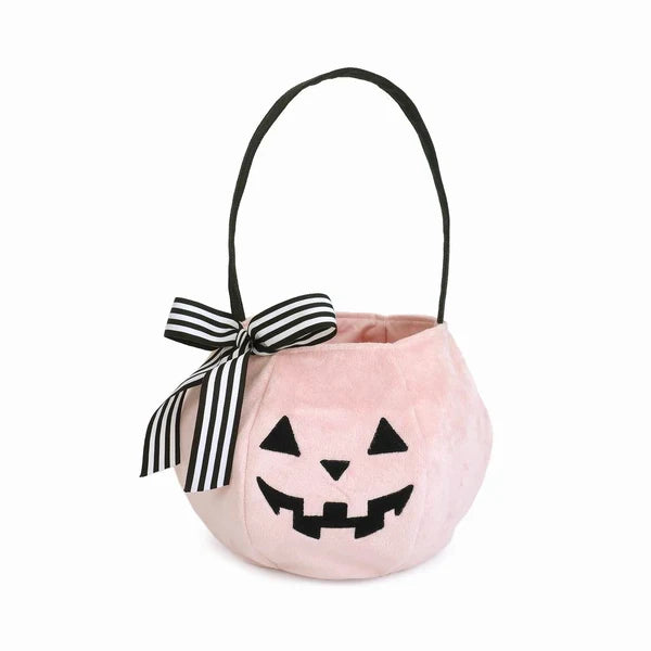 Mon Ami Pink Pumpkin Halloween plush candy bag featuring an embroidered jack-o'-lantern face and a black and white striped ribbon bow.