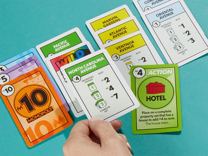 Monopoly game cards on a blue background