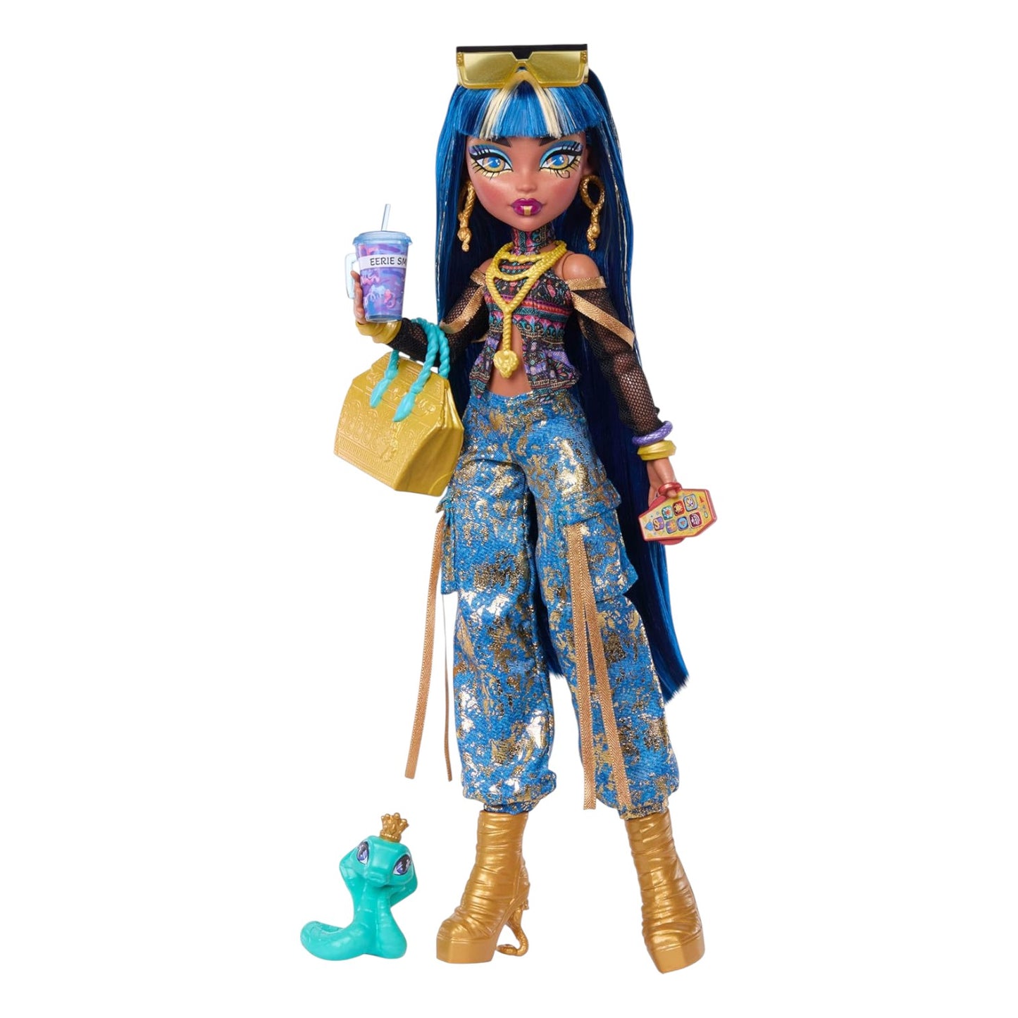 Monster High Cleo De Nile Core Refresh doll wearing gold-flecked cargo pants, holding a gold tote bag and pet snake Hissette.