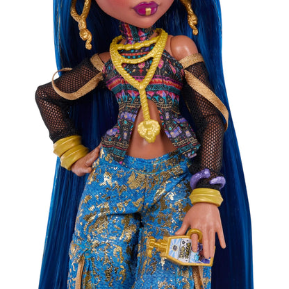 Monster High Cleo De Nile Core Refresh doll with blue hair and colorful outfit holding a bottle on a white background