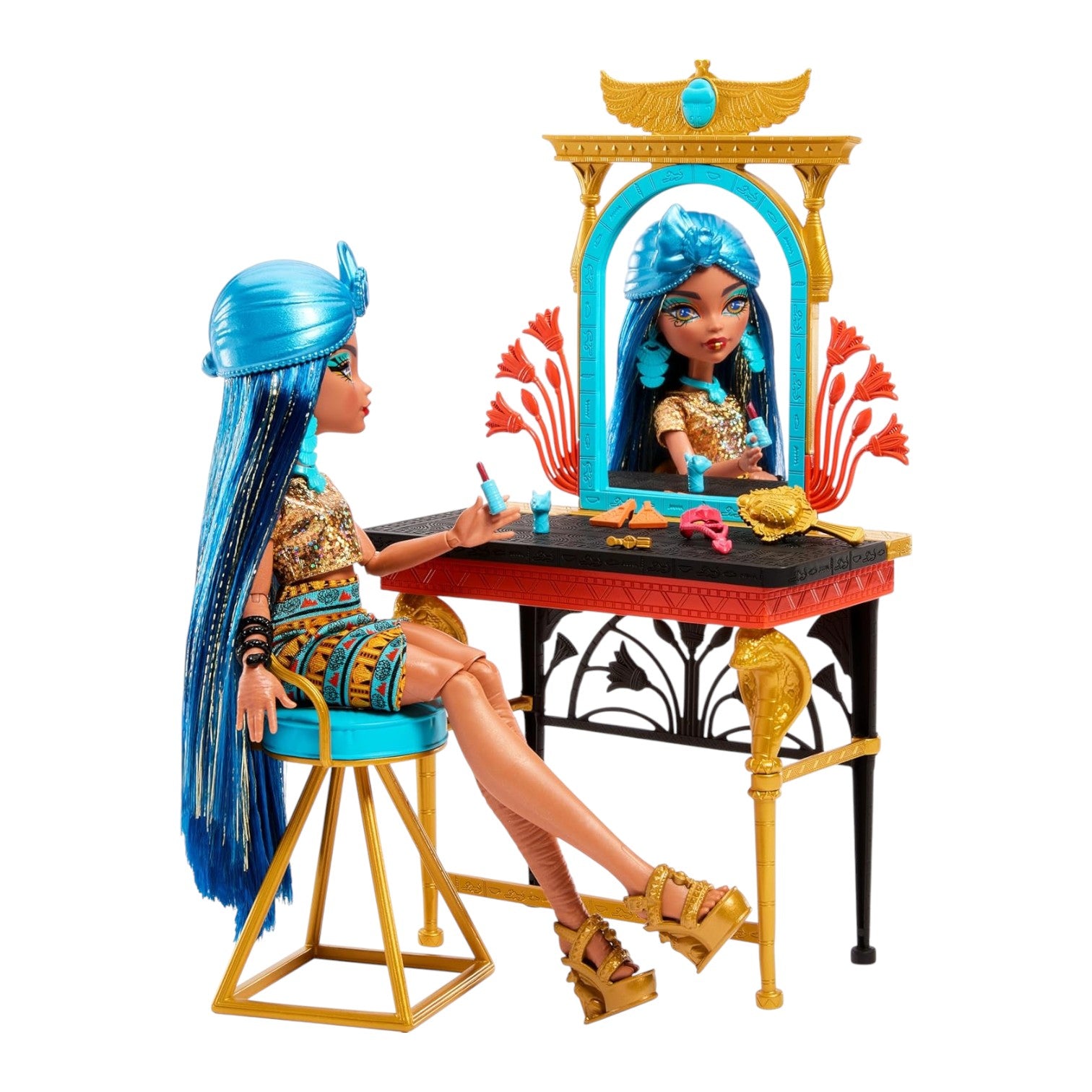 Toy doll with blue hair sitting at a vanity table with mirror