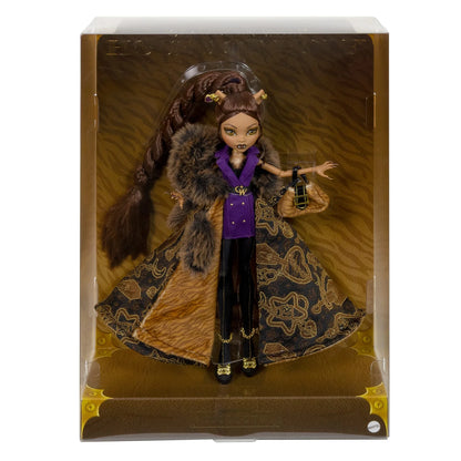 Doll in elaborate outfit with fur and purple top in packaging