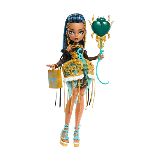 Product view of Monster High Scary Sweet Birthday Cleo De Nile doll wearing a gold cage skirt and holding a scarab beetle balloon.