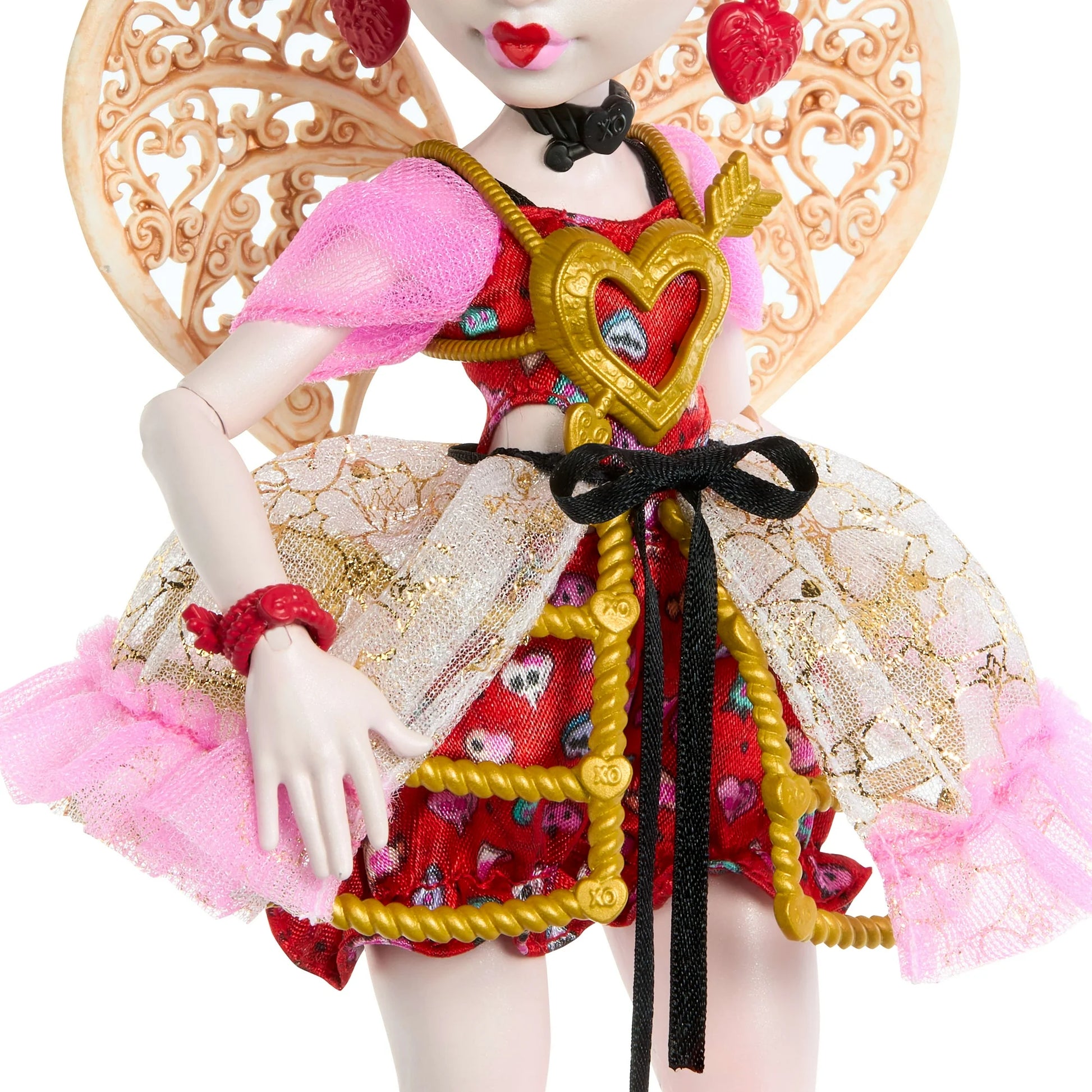 Detailed doll with a decorative heart key and intricate clothing on a white background