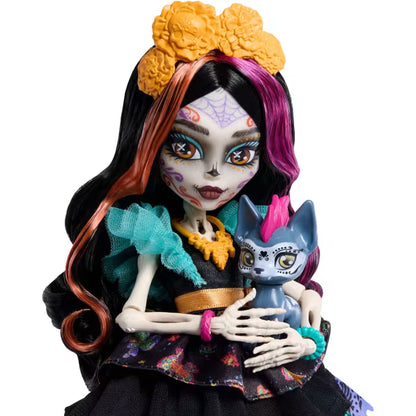 Monster High Skelita Calaveras fashion doll wearing a colorful papel picado dress alongside her pet xolo dog Candelita.