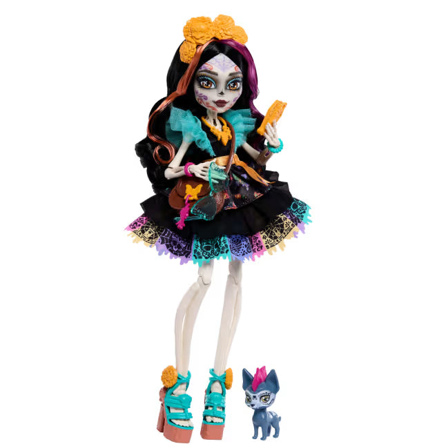 Monster High Skelita Calaveras fashion doll wearing a colorful papel picado dress alongside her pet xolo dog Candelita.