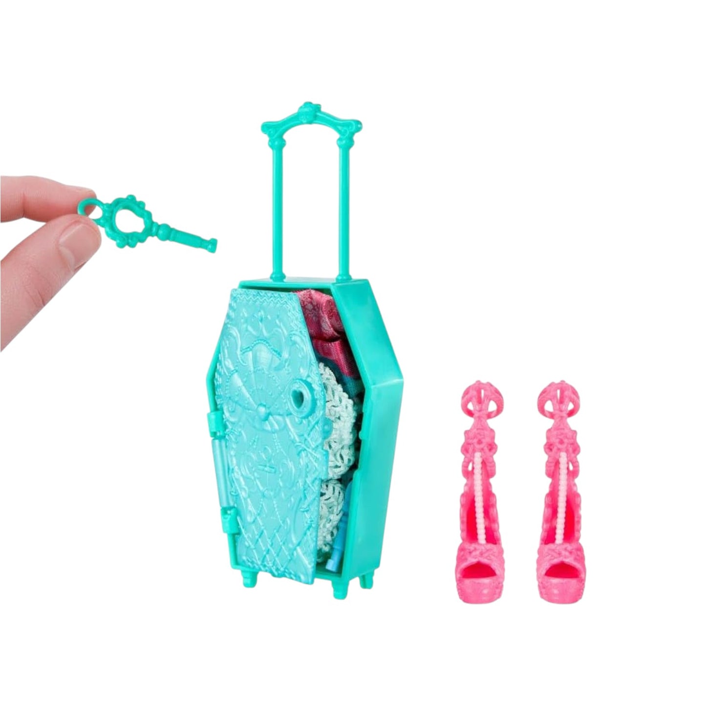 Toy suitcase with a key and pink shoes on a white background