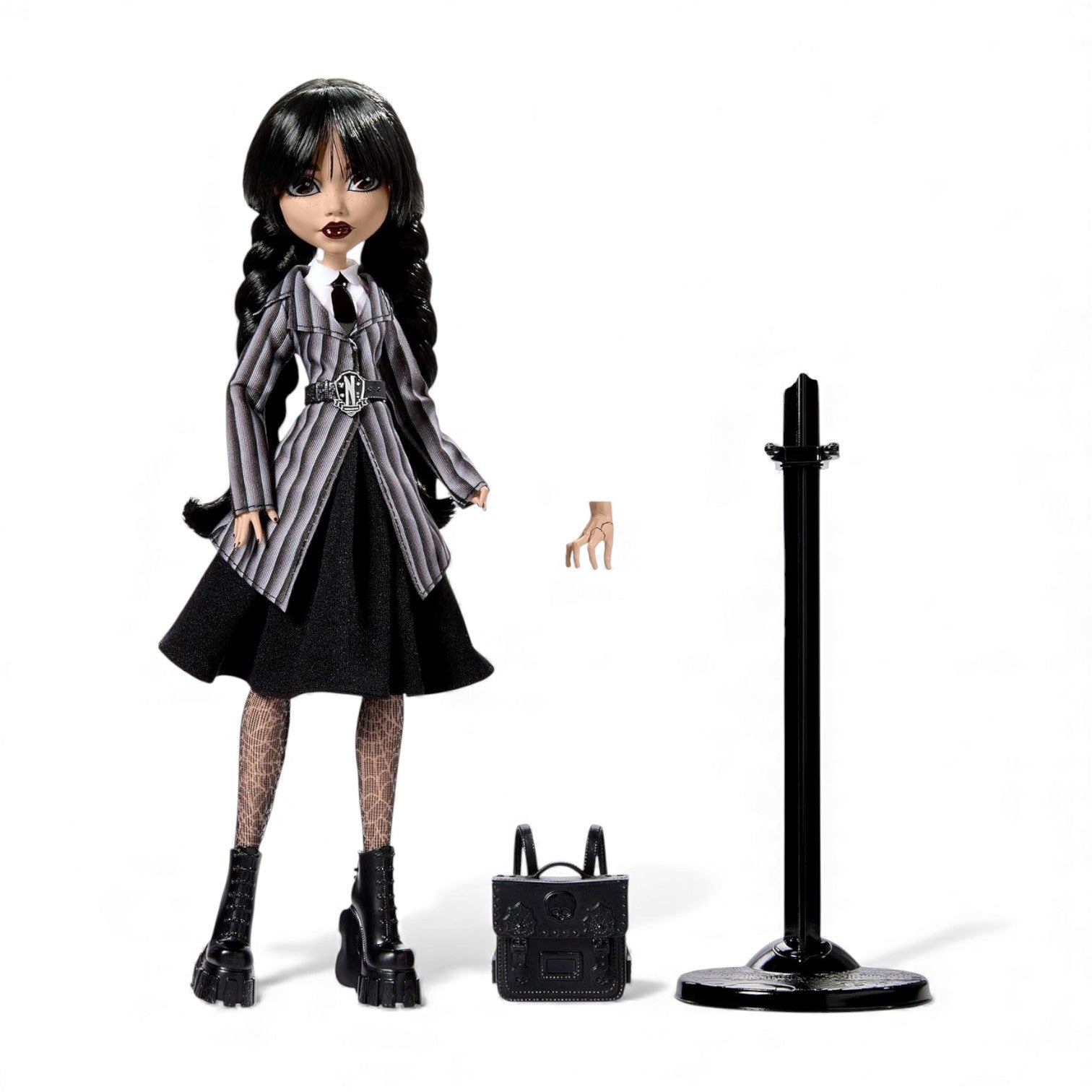 Doll in a black and gray outfit with accessories on a white background