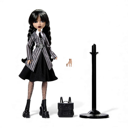 Doll in a black and gray outfit with accessories on a white background