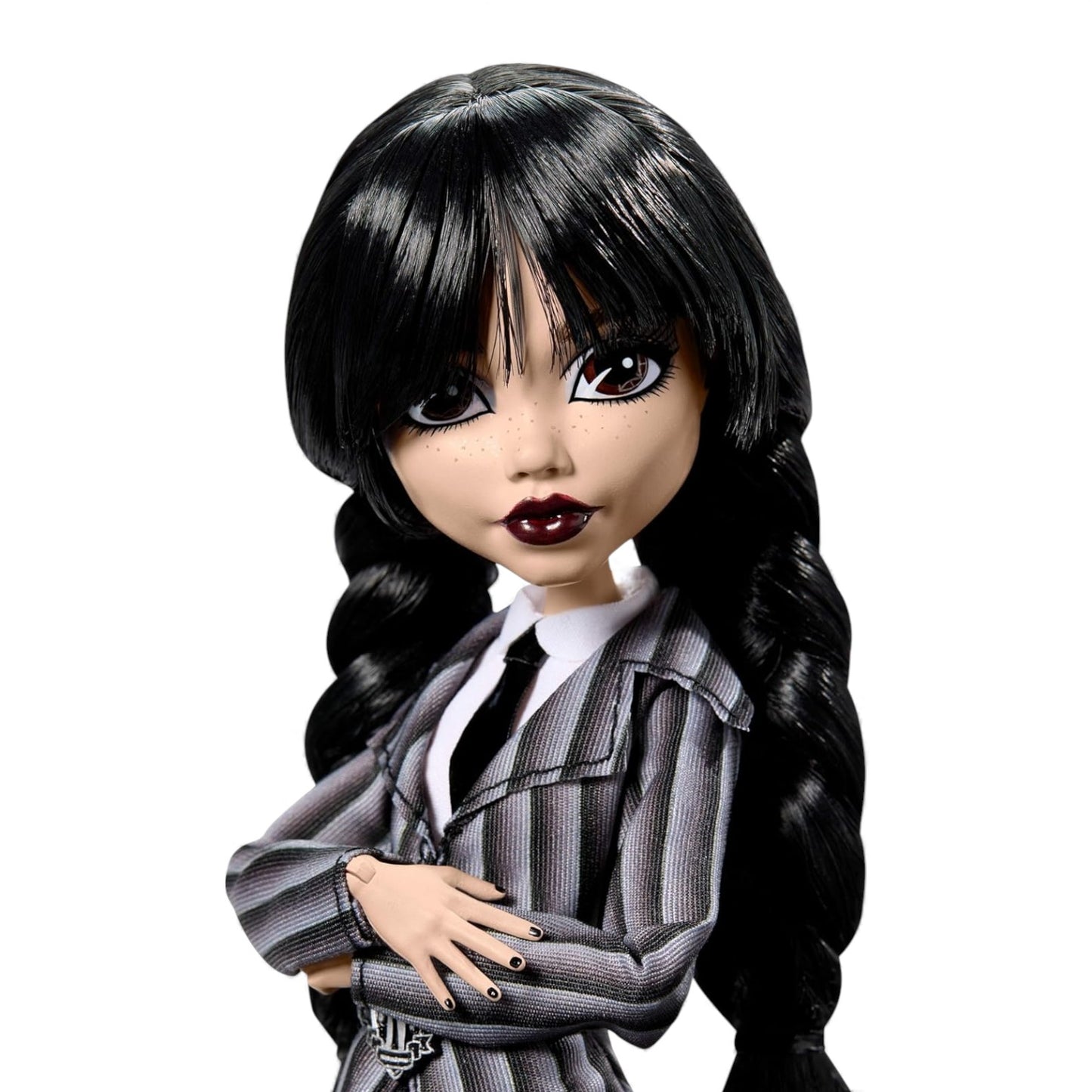 Doll with long black hair and dark makeup wearing a striped outfit on a white background