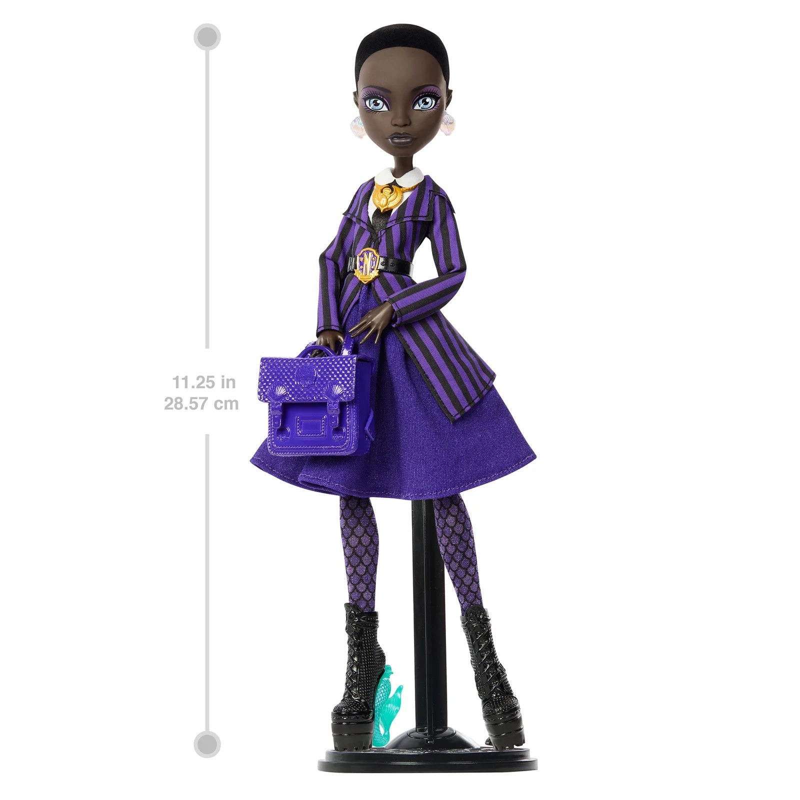 Doll in a purple outfit with a measuring stick on a white background