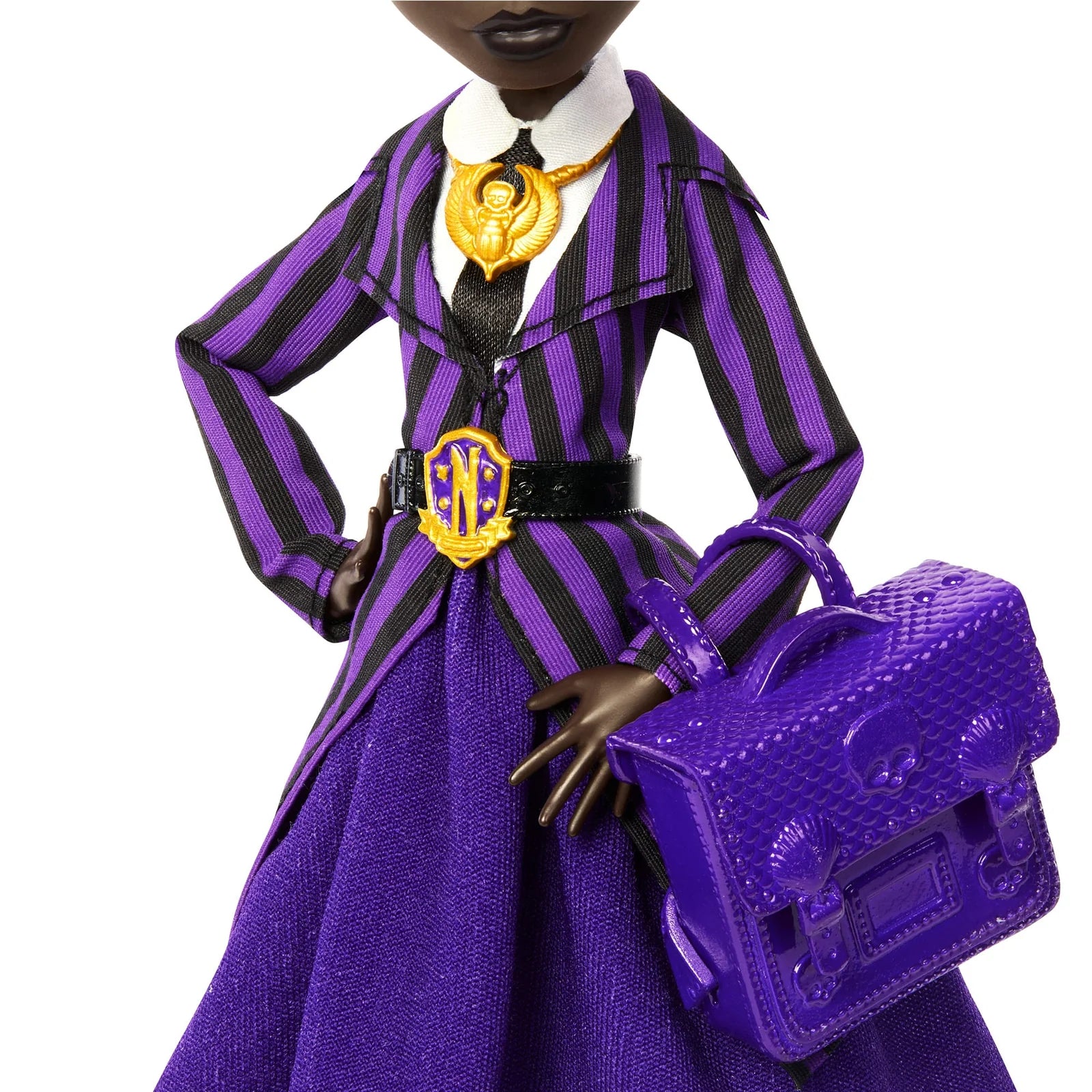 Doll in a purple and black striped outfit with a matching handbag on a white background